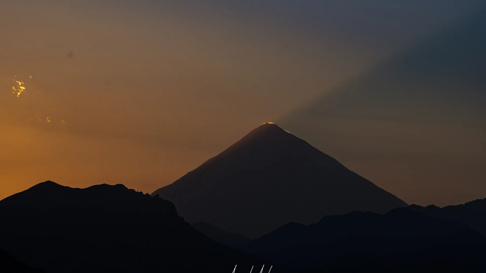 Snow-capped Mount Damavand glowing at sunset